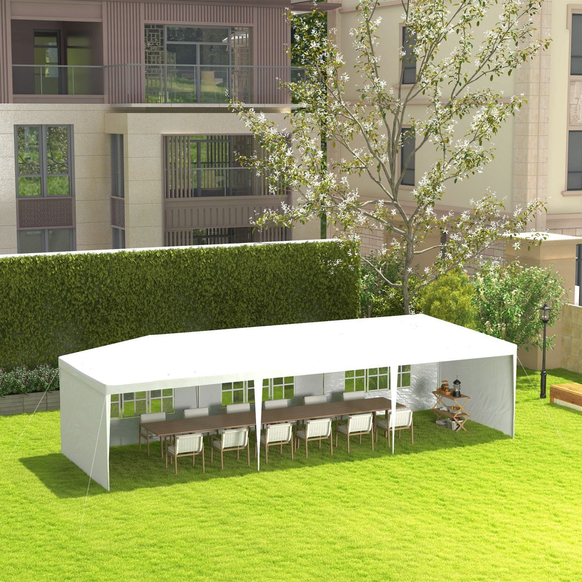 Outdoor seating area with white canopy, tables, and chairs in a garden setting.