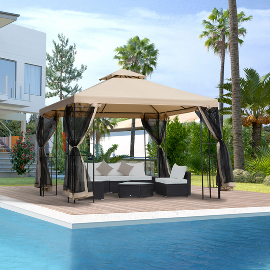 Outdoor gazebo with curtains over a patio set by a pool, with palm trees and a building in the background.